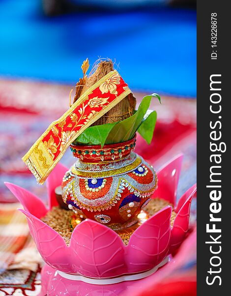 Copper kalash with coconut and mango leaf with floral decoration ,