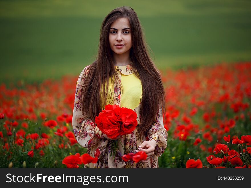 Close Up Portrait Of Hair Long Young Woman With Flower Poppy, Holdings In Hands A Bouquet Of A Red Flowers