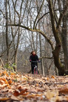 Young Female Bicycle Rider In Autumn Park Stock Photo Young Female Bicycle Rider In Autumn Park Stock Photo
