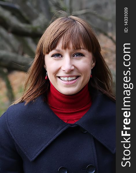 Young female smiling in autumn environment