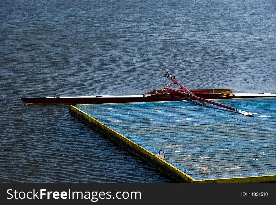 Empty kayak - wooden dock - water