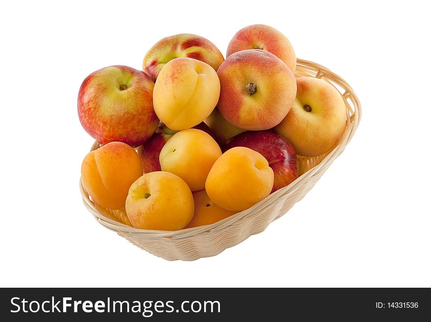 Fruits in basket with hand made clipping path, isolated against white background