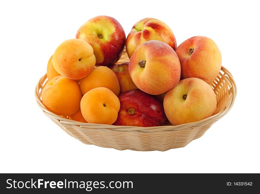 Fruits in basket with hand made clipping path, isolated against white background