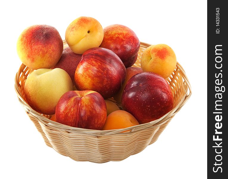 Fruits in basket with hand made clipping path, isolated against white background