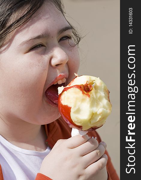 Little girl eating apple outdoor. Little girl eating apple outdoor