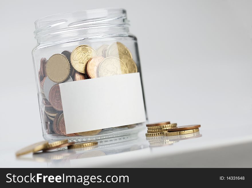 Jar of coins with label for your own text