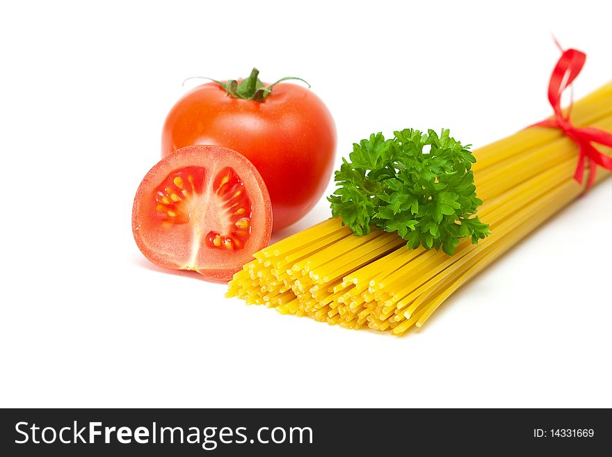 Tomato with parsley and pasta on a white background