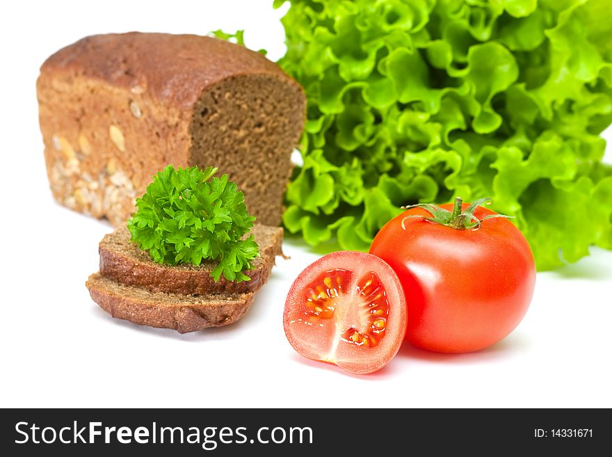 Tomato with salad and bread on a white background