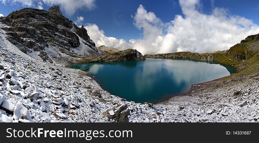 Blue lake in winter landscape - Swiss Alps