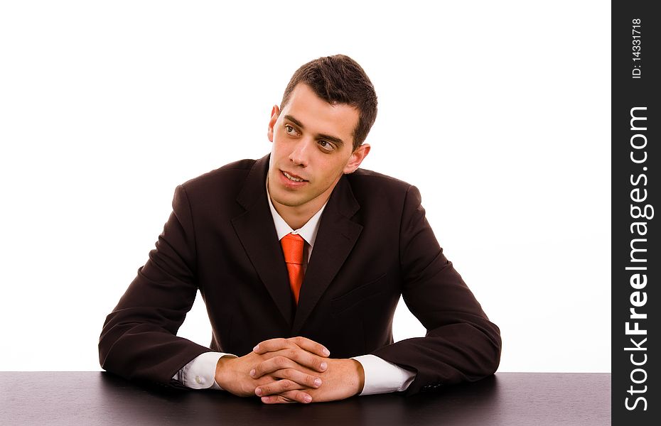 Pensive businessman on a desk at the office