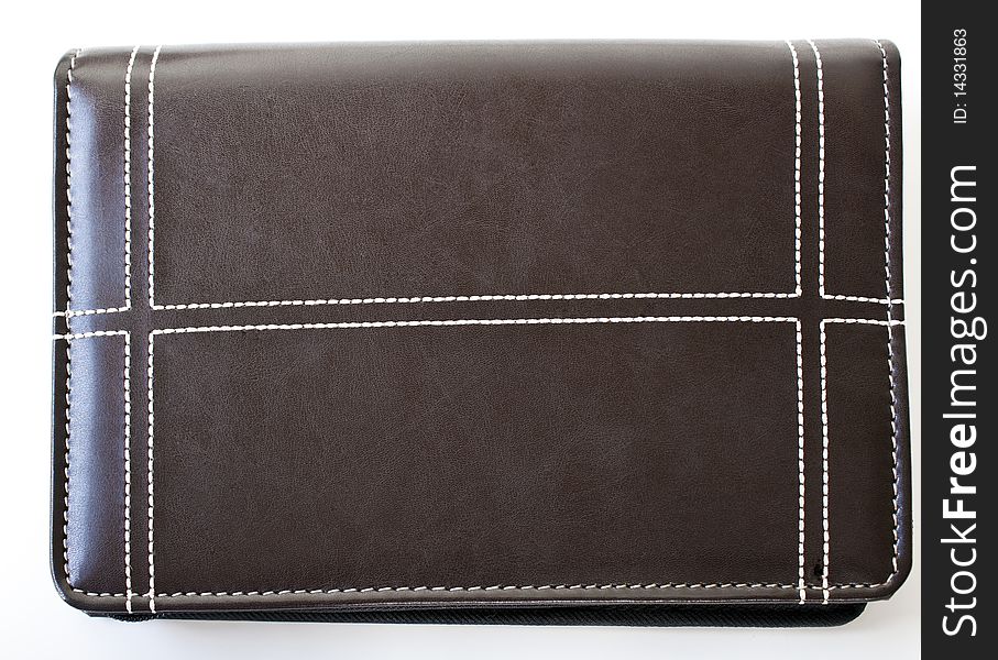 Brown leather folder with white stitching and isolated on a white background