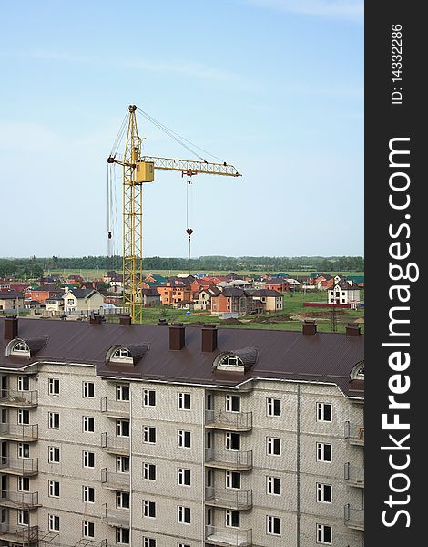 Construction of multi-story brick apartment house on the outskirts of the city. Construction of multi-story brick apartment house on the outskirts of the city
