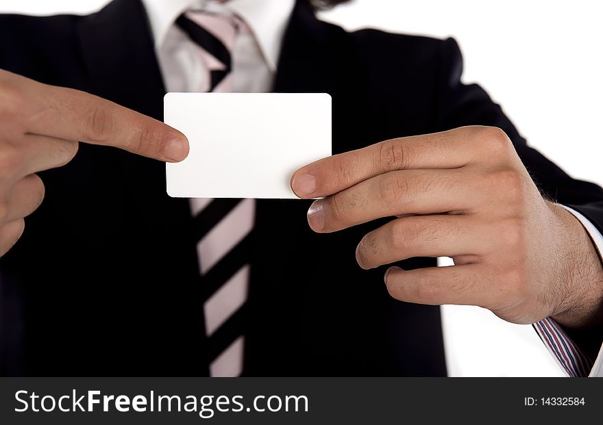Businessman pointing to a blank businesscard. Businessman pointing to a blank businesscard