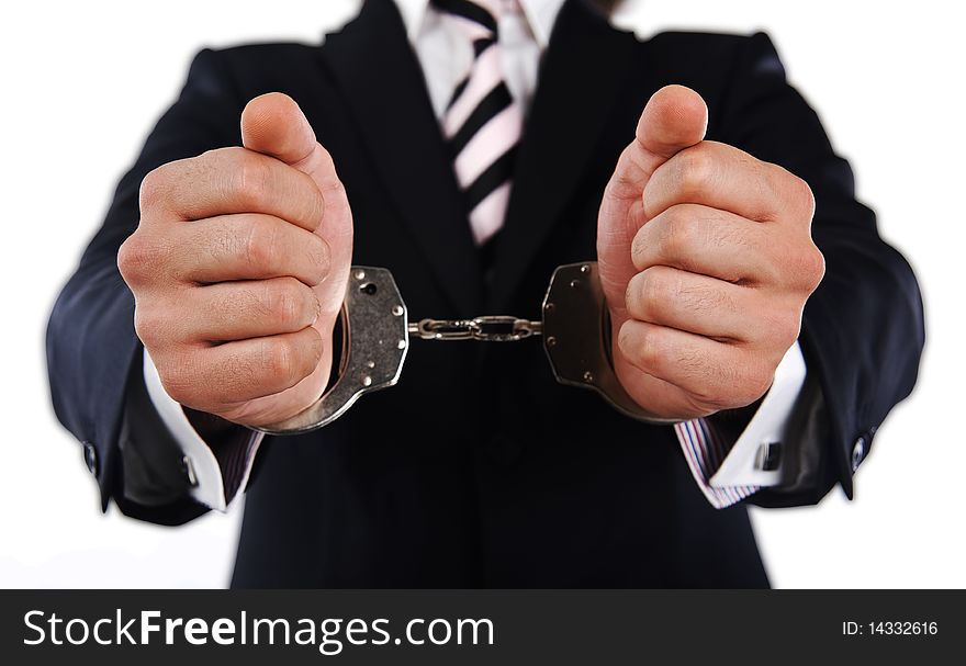 Businessman with a striped necktie showing handcuffed hands. Businessman with a striped necktie showing handcuffed hands