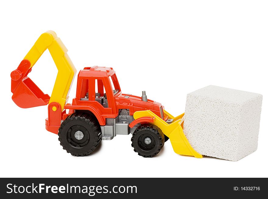 Toy tractor and the block isolated over white