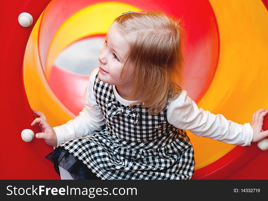 A 3 year old girl in playground equipment. A 3 year old girl in playground equipment