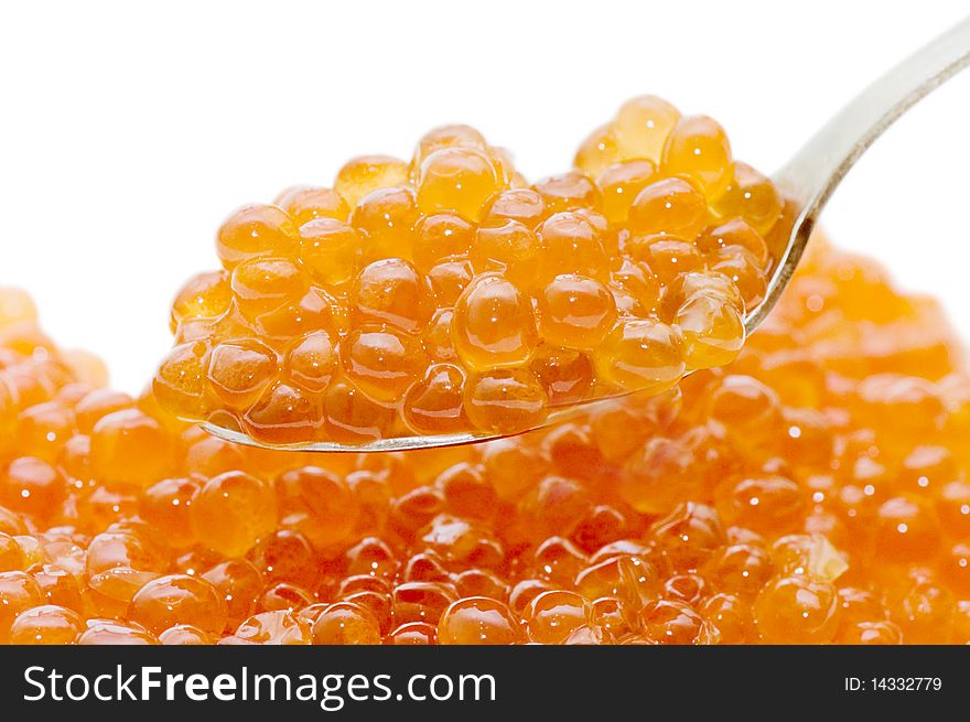 Teaspoon red caviar isolated over white