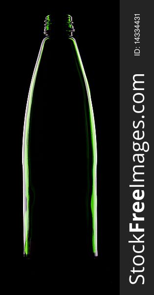 Empty green glass bottle on the black background. Empty green glass bottle on the black background