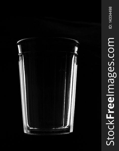 Thick glass tumbler on black