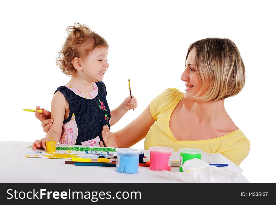 A young mom and her little daughter paint colors in this album