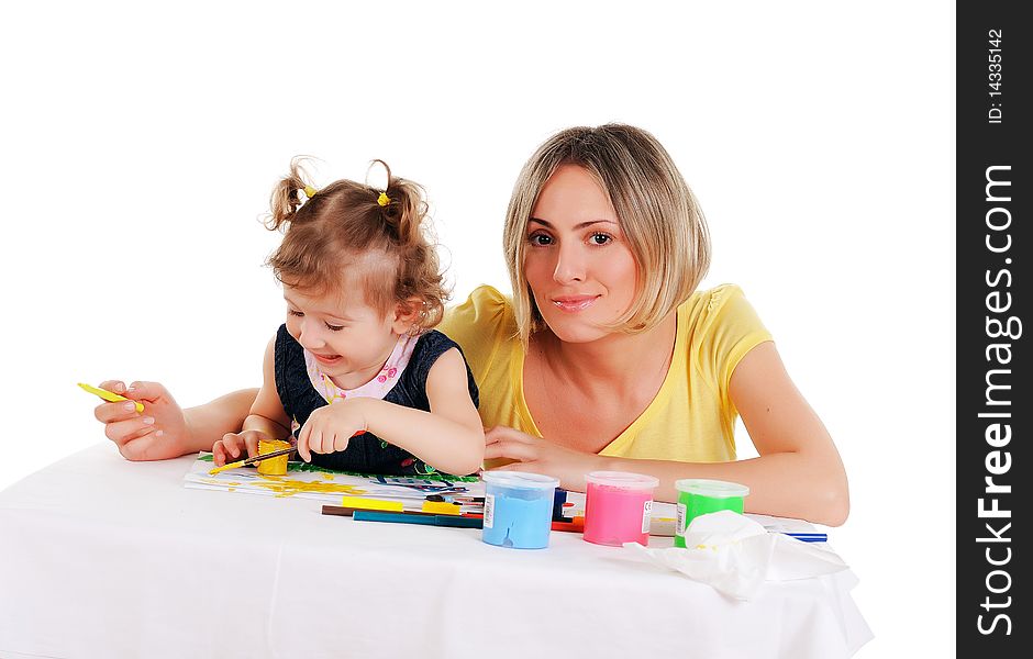 A young mom and her little daughter paint colors in this album