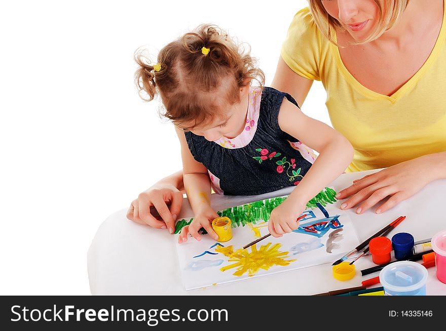 A young mom and her little daughter paint colors in this album