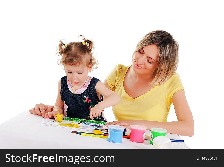 A young mom and her little daughter paint colors in this album