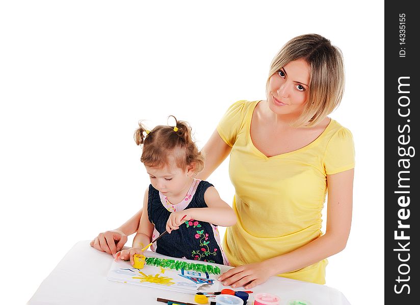 A young mom and her little daughter paint colors in this album