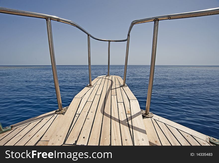View of the ocean looking from the bow of a sailing yacht. View of the ocean looking from the bow of a sailing yacht
