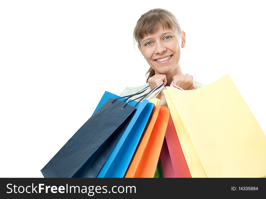 Happy woman with shopping bags over white background