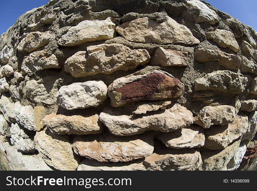 Stone wall deformed with the perspective of a fisheye