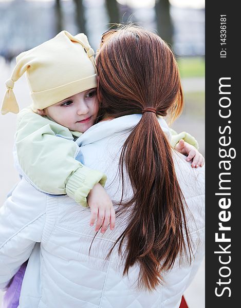 Mother holds little girl on hands. Mother holds little girl on hands