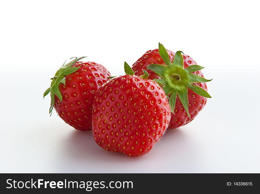 Group of ripe fresh strawberries isolated on white. Clipping path included. Group of ripe fresh strawberries isolated on white. Clipping path included