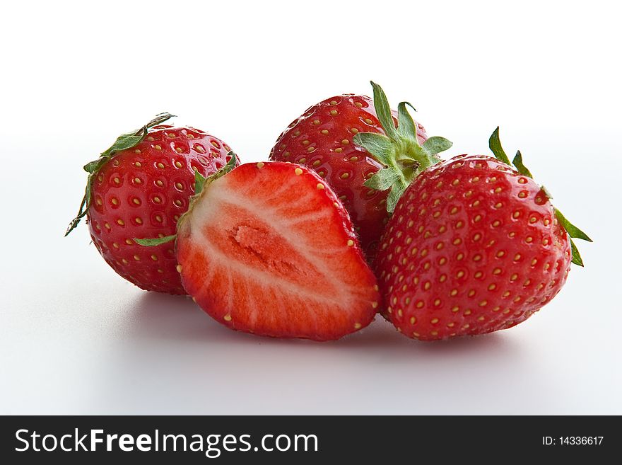 Group of ripe fresh strawberries isolated on white. Clipping path included. Group of ripe fresh strawberries isolated on white. Clipping path included