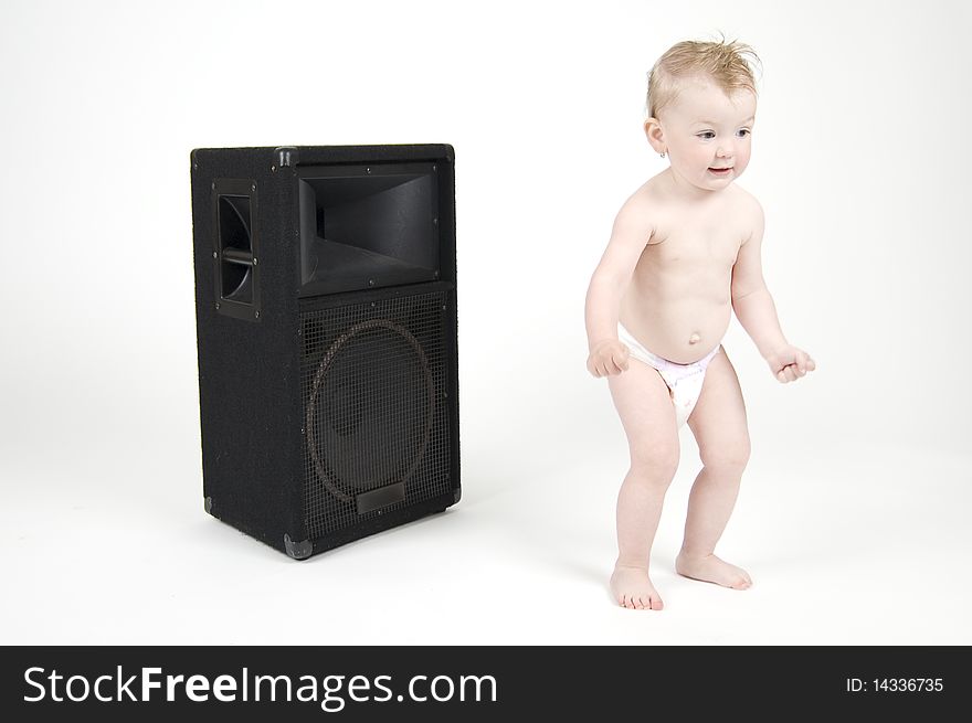 Baby girl dancing in front of reproducer