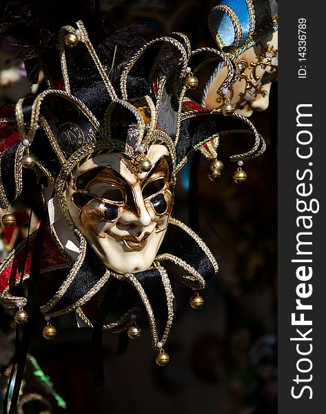 A Venetian Mask displayed on a dark background, Venice, Italy. A Venetian Mask displayed on a dark background, Venice, Italy