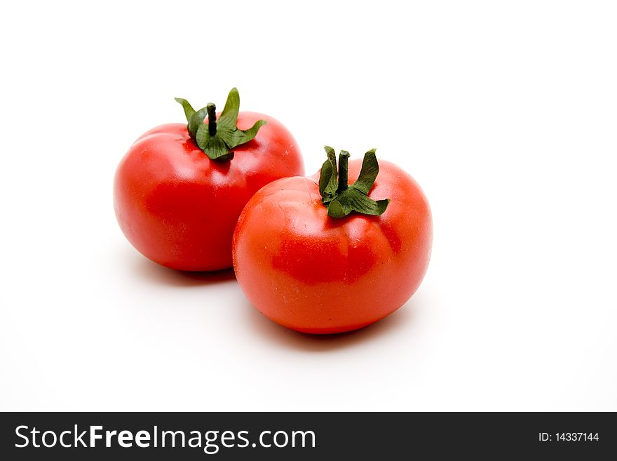 Refine tomatoes onto white background
