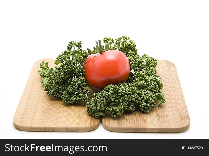 Tomato with parsley on edge board