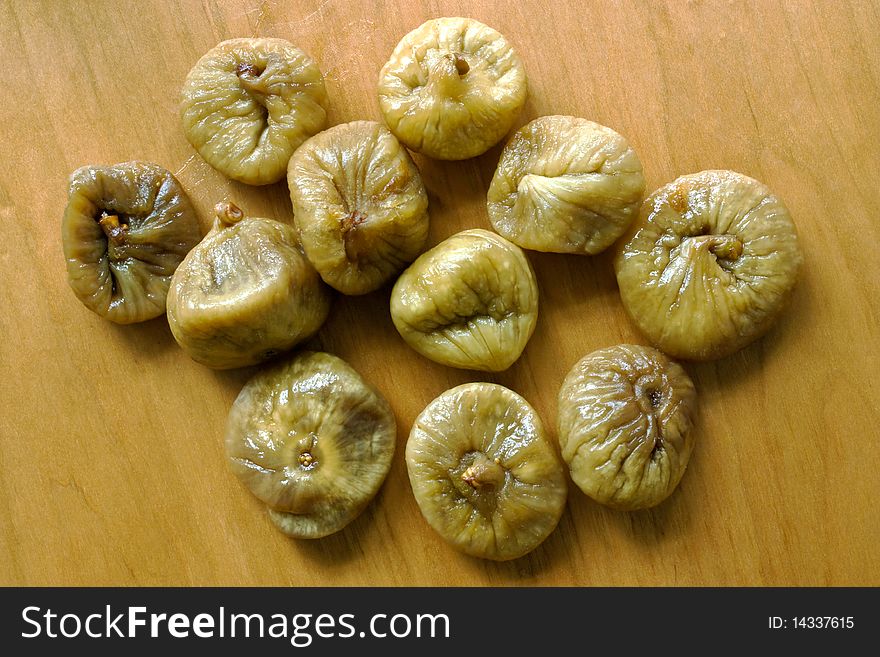A close-up of sweet dried figs on a wood board