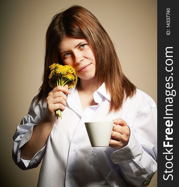 Girl with coffee. studio shot