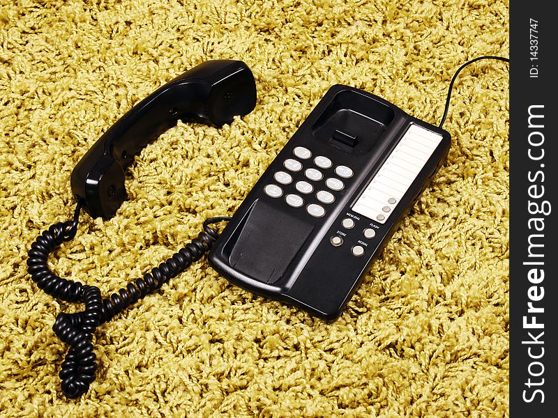 Vintage telephone on the carpet