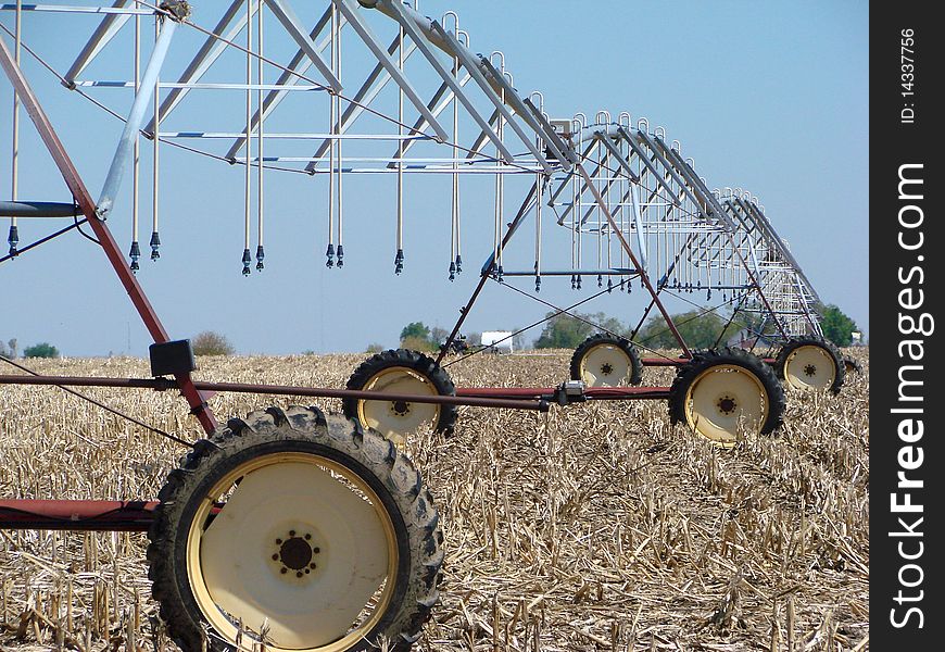 Irrigation pivot in corn field. Irrigation pivot in corn field.