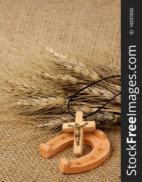 Christian cross wheat ears and horseshoe - prosperity belief luck - religious concept