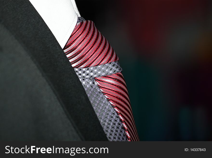 Dark jacket and tie at a clothing store. Dark jacket and tie at a clothing store