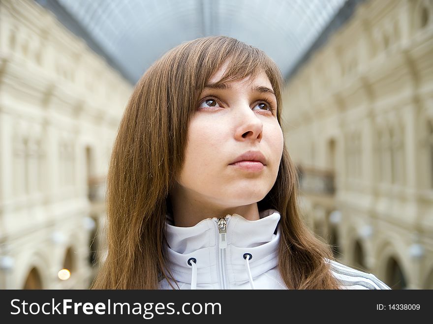 Beautiful young girl under the glass arch gallery