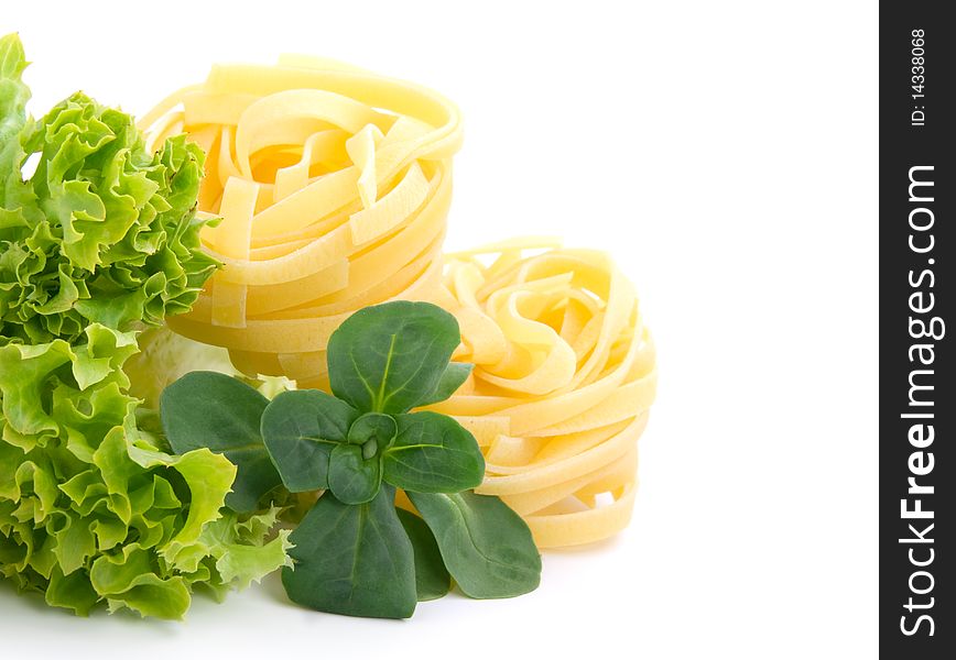 Fresh salad, lettuce leaves and macaroni isolated on white background