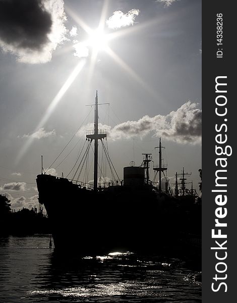 Ship silhouette and cloudy sunset sky background. Ship silhouette and cloudy sunset sky background