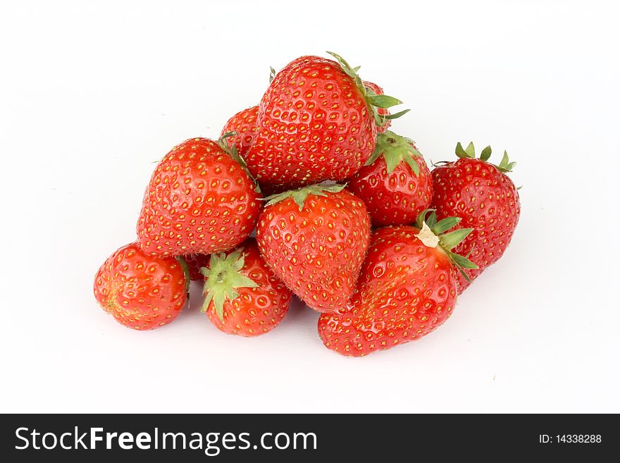 Heap of strawberries isolated on white background