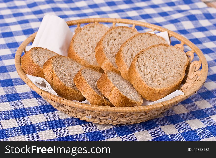 Slaced French bread in the basket. Slaced French bread in the basket