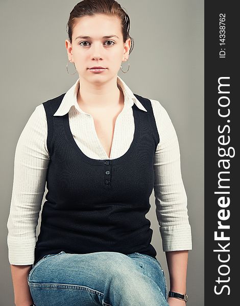 Portrait of a young woman siting down